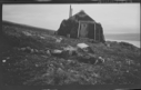 Image of Stone hut, sign over door: Moskus Heimen Exp.1928-30